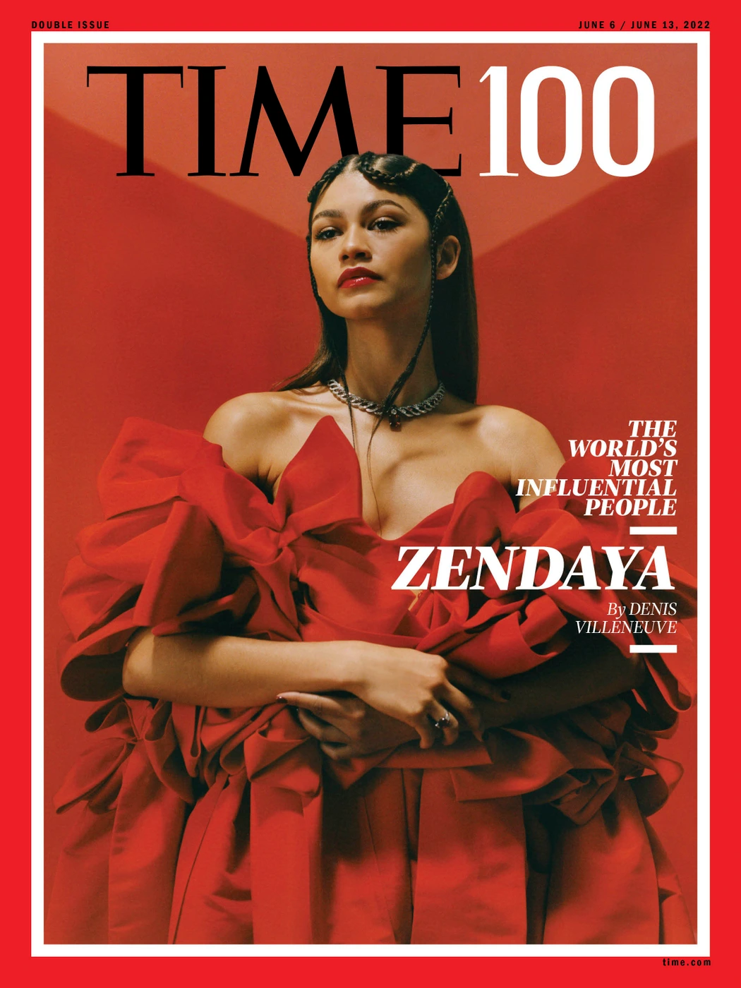 Zendaya wearing a sculptural red gown on a magazine cover styled by Micah Schifman against a warm red background.