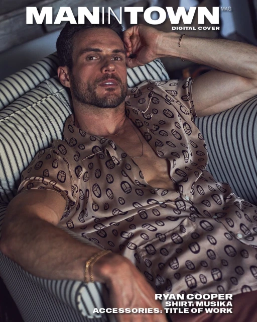 Ryan Cooper sits in a striped chair wearing a patterned shirt in a magazine cover shot with muted colors and studio lighting.