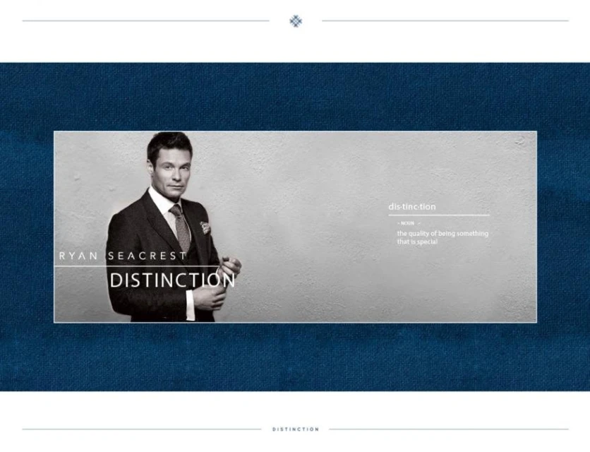 Promotional image of Ryan Seacrest in a dark suit and tie, posing in front of a textured off-white background with blue accents and text.