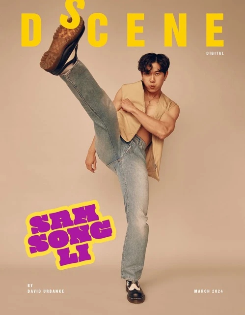 A magazine cover featuring a full shot of a muscular Asian male model posing with a high kick, wearing jeans and a beige vest against a solid background.