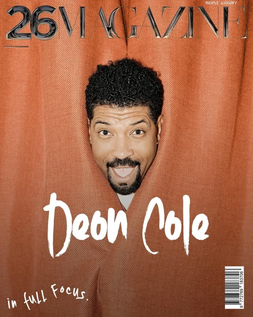 Magazine cover featuring Deon Cole, face centered within a jagged orange frame, showcasing a playful tongue-out expression.