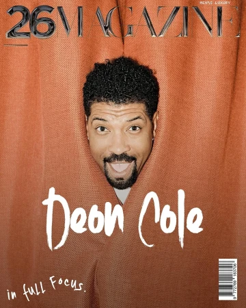 Magazine cover featuring Deon Cole, face centered within a jagged orange frame, showcasing a playful tongue-out expression.