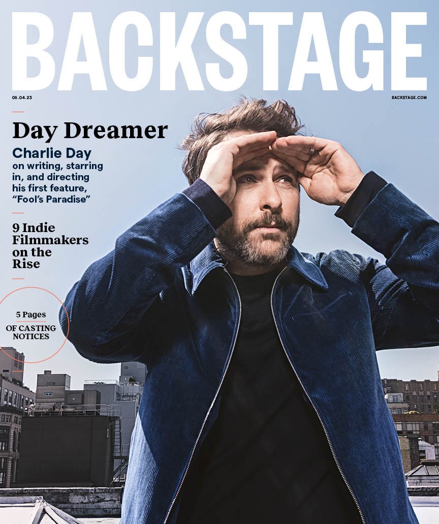 Magazine cover of Backstage featuring actor Charlie Day with a city skyline background and cover text and casting notices.