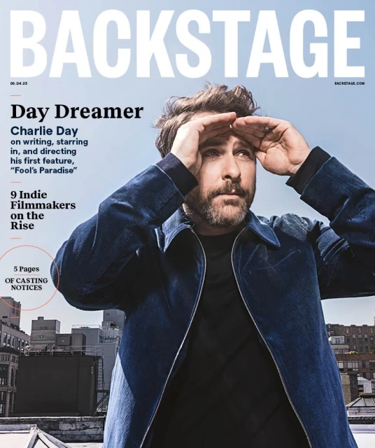 Magazine cover of Backstage featuring actor Charlie Day with a city skyline background and cover text and casting notices.