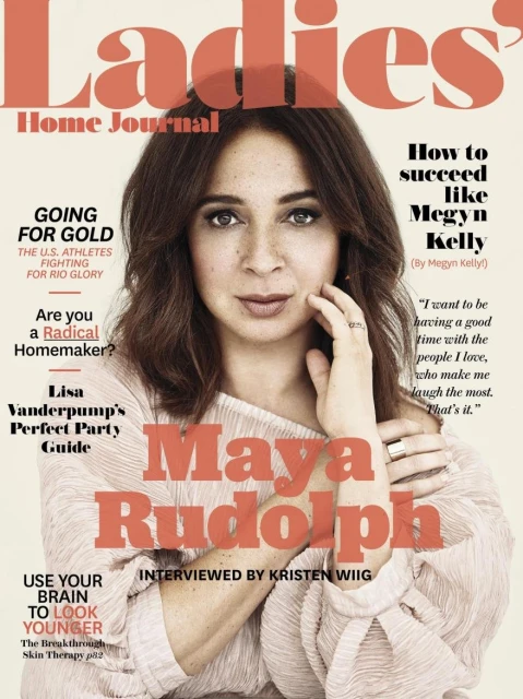 Close-up of Maya Rudolph on a magazine cover, featuring a coral-colored title, along with additional text detailing the magazine's content.
