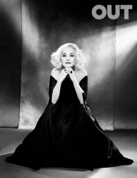 Jessica Lange with voluminous blonde hair wearing a black off-the-shoulder gown, styled by Negar Ali Kline against a textured backdrop