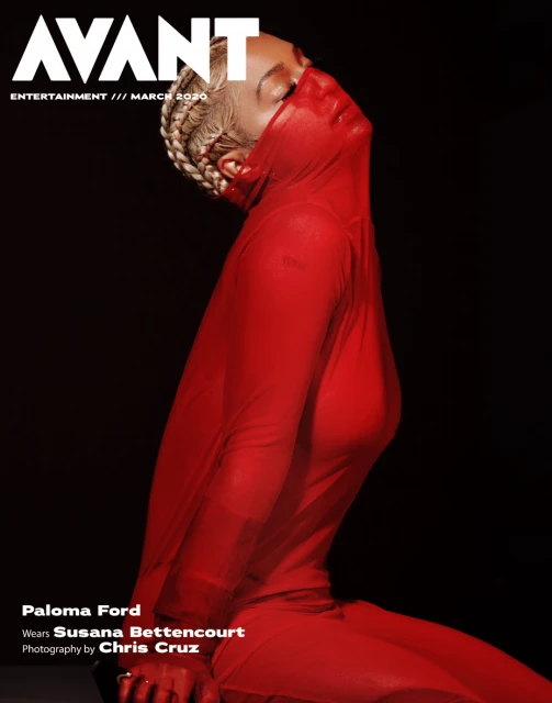 Magazine cover featuring Paloma Ford wearing a red, sheer fabric, head tilted back against a black background.