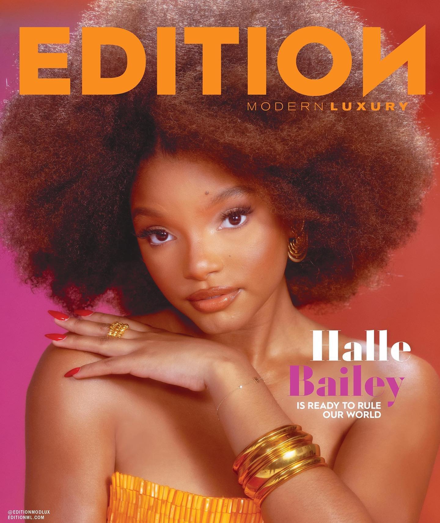 Cover of Edition Modern Luxury magazine featuring Halle Bailey in an orange dress and large afro hairstyle, with pink and orange gradient background.