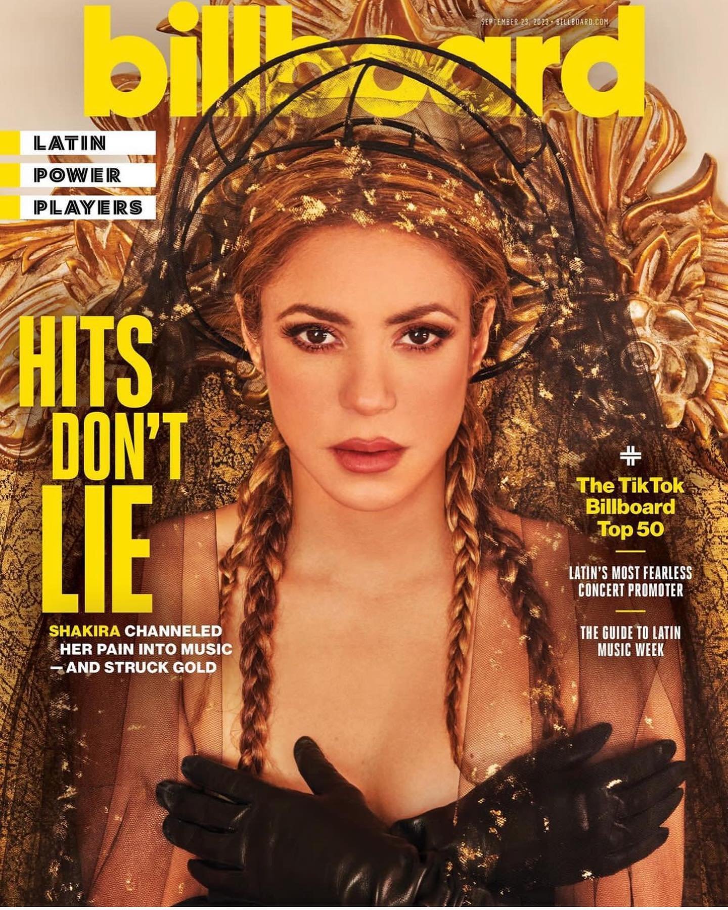Billboard cover featuring Shakira in a portrait-style shot. She is wearing a gilded headpiece and black gloves against a textured gold background.