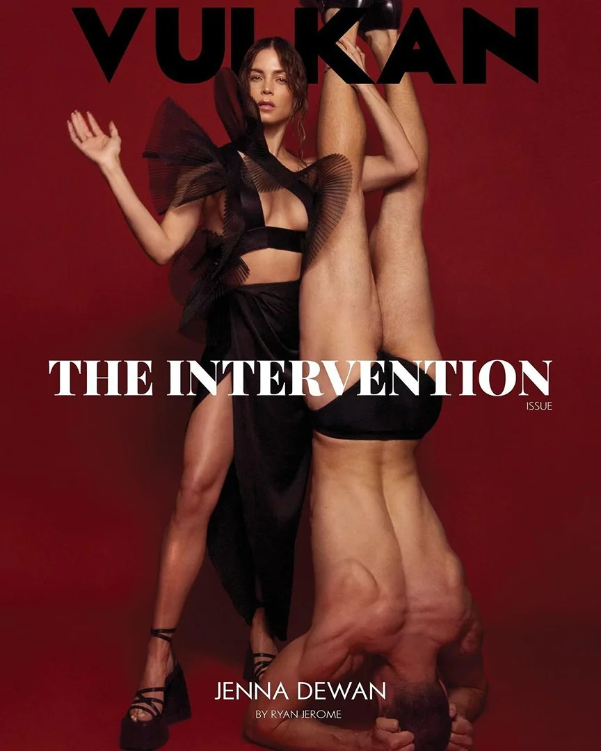 Magazine cover featuring Jenna Dewan in a black dress with tulle detail, alongside a man doing a handstand on a red background.