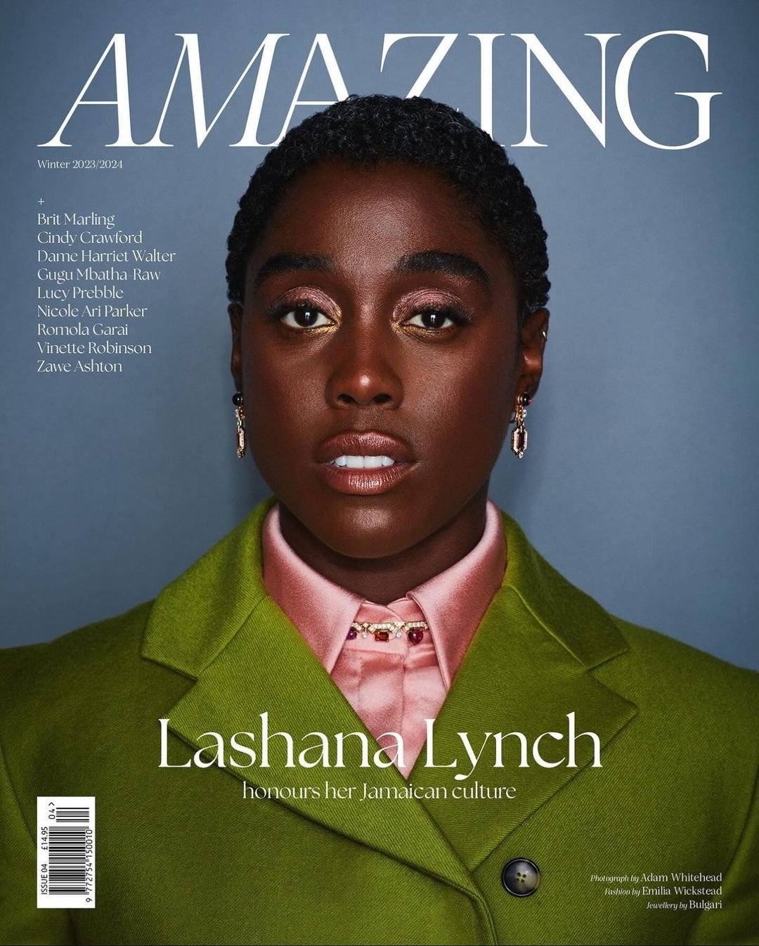 Magazine cover featuring Lashana Lynch, honors Jamaican culture. The close-up shot highlights her in a green coat and soft pink shirt.
