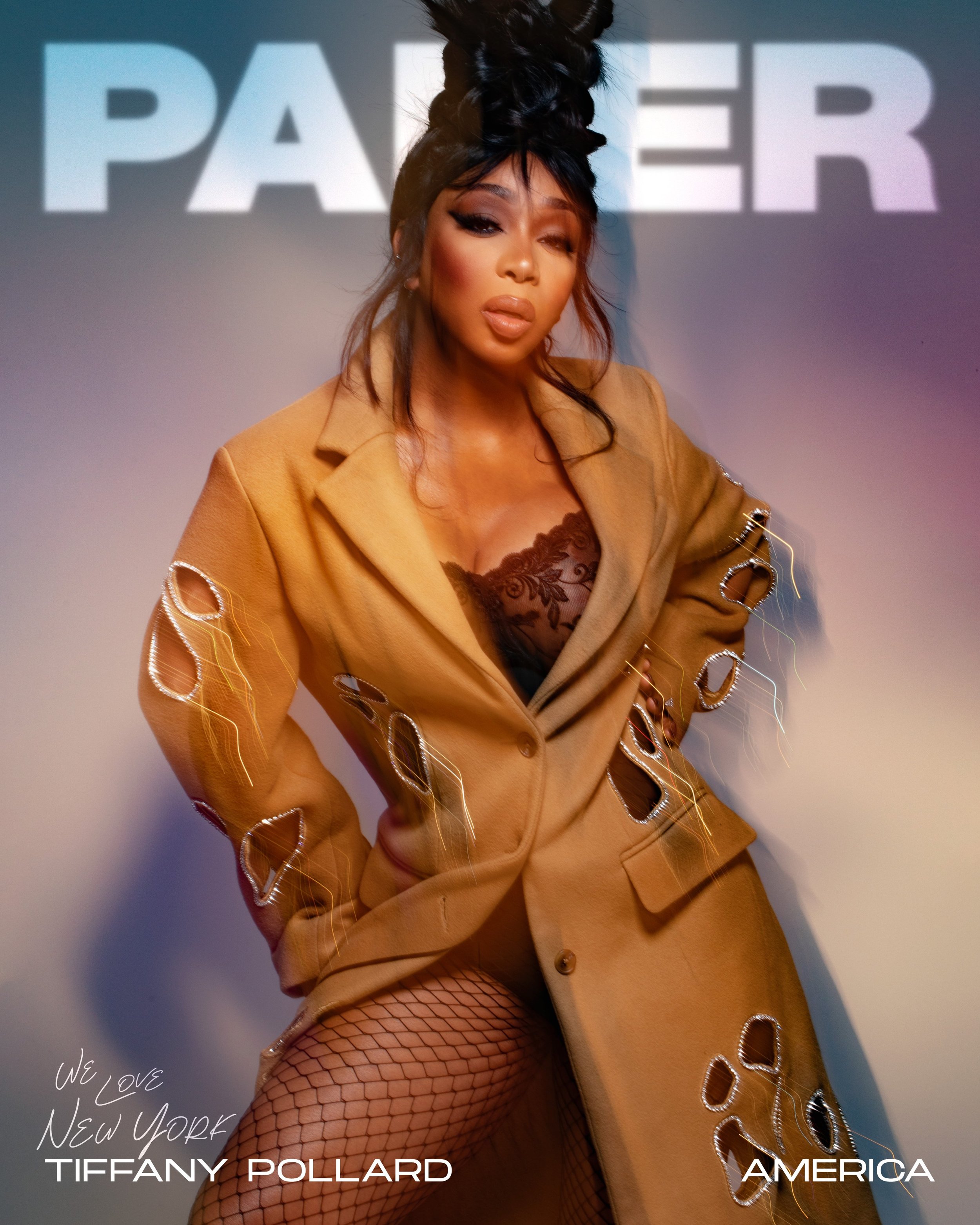 Woman in a beige cut-out blazer and fishnet tights with elaborate dark hair styling and make-up by Renee Sanganoo.