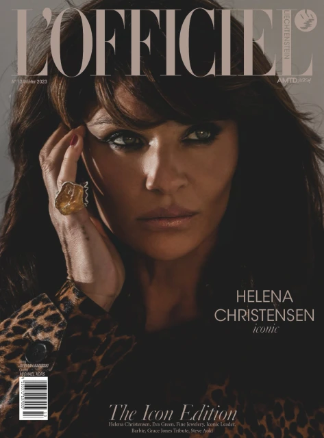 Helena Christensen stars on a magazine cover. The portrait features Christensen in a leopard print jacket and a large gemstone ring.