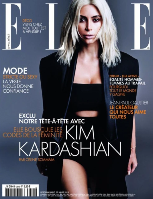 Magazine cover featuring Kim Kardashian in a black jacket with blonde hair against a grey background. The 'ELLE' logo is visible at the top.