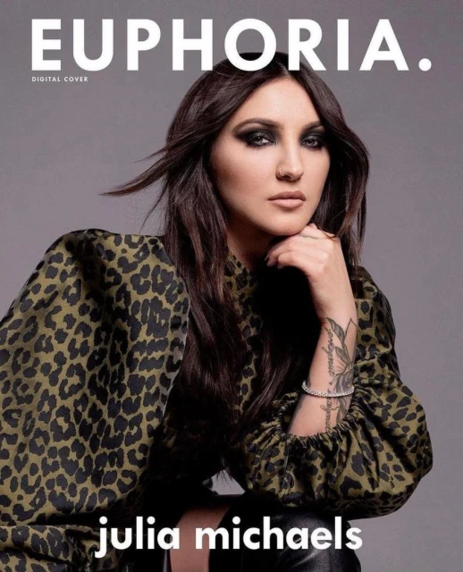 Julia Michaels poses for Euphoria digital cover, wearing a leopard-print top with dramatic eye makeup and styled long dark hair.