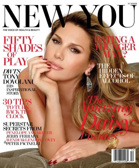 Magazine cover featuring a blond woman with manicured red nails. The magazine is titled NEW YOU, with text excerpts on health and beauty.