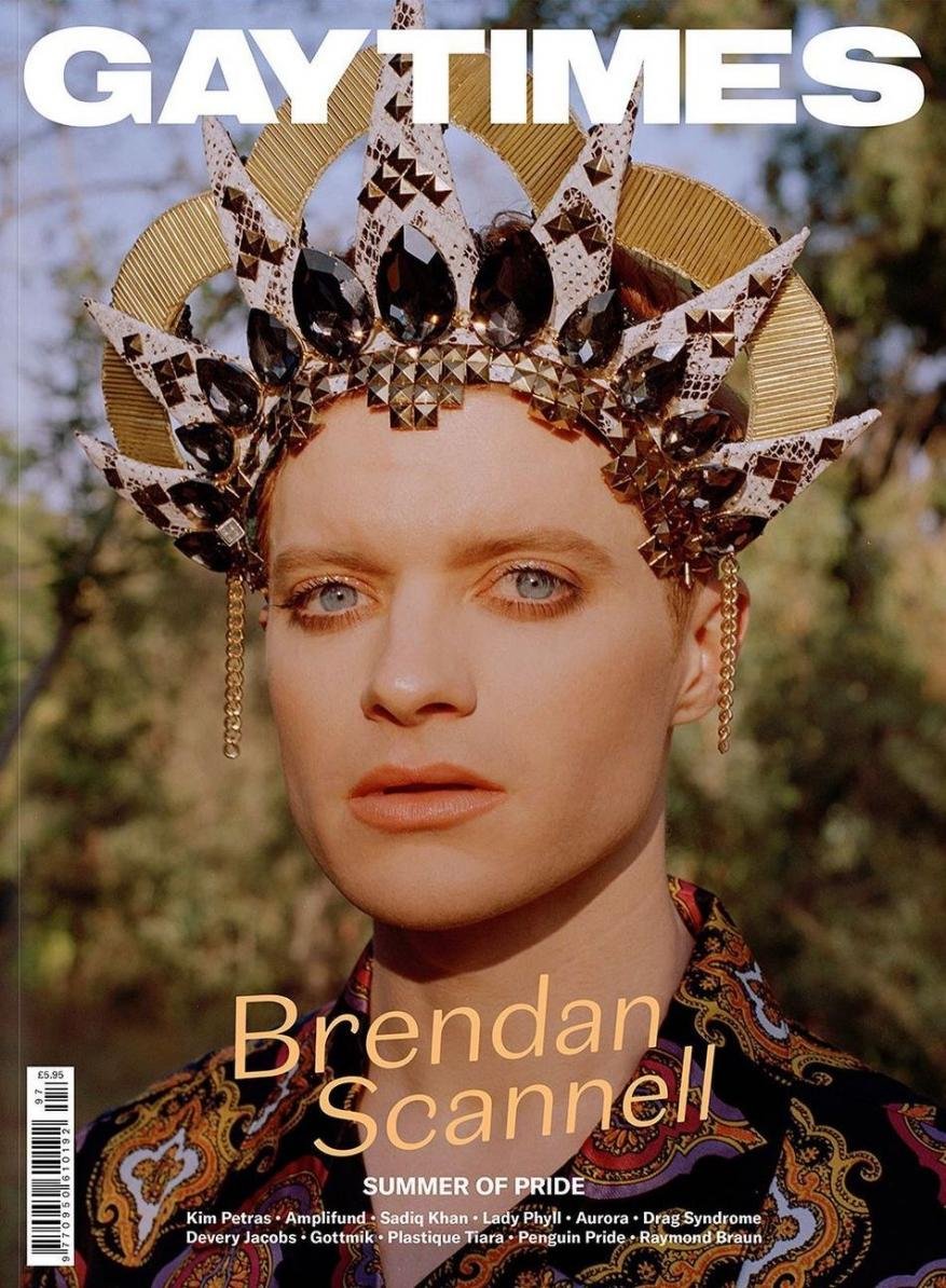 Magazine cover featuring a close-up of Brendan Scannell wearing an elaborate jeweled crown, against an outdoor, naturally lit backdrop.