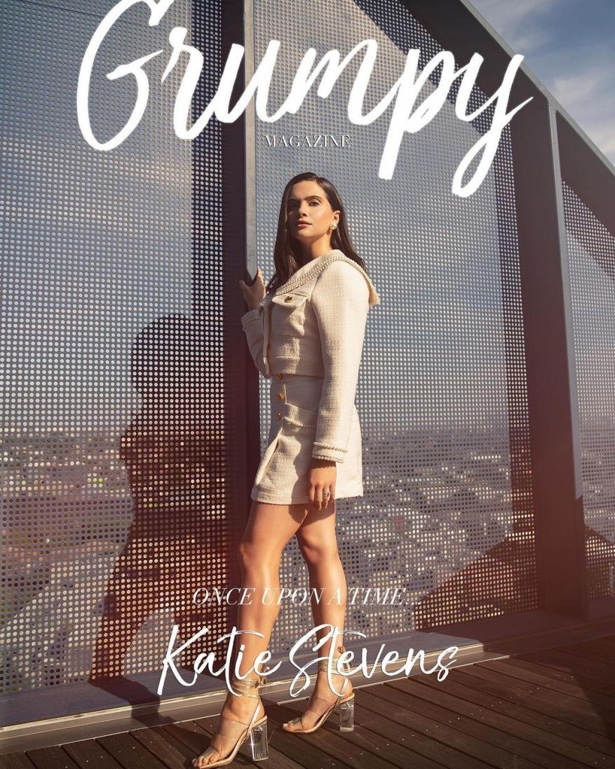 Fashion magazine cover featuring a young adult woman in a tweed skirt suit, accessorized with high-heeled sandals and gold earrings.