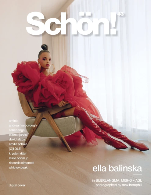 Ella Balinska magazine cover: A woman in a red dress and matching boots sits in a chair against a neutral background, promoting Schön! magazine.