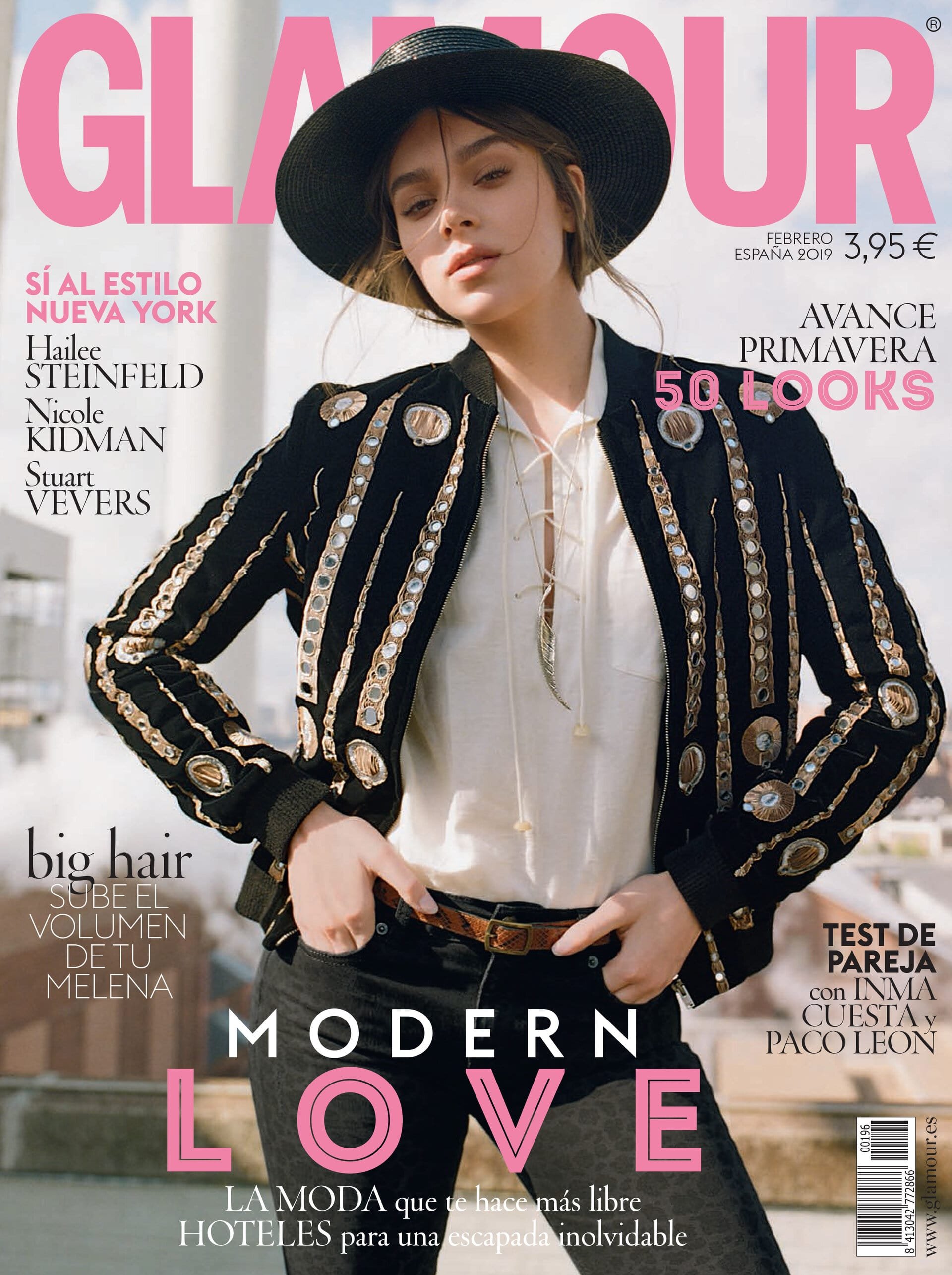 Glamour magazine cover featuring Hailee Steinfeld in a black hat and embellished jacket, with pink Glamour logo and cover text.