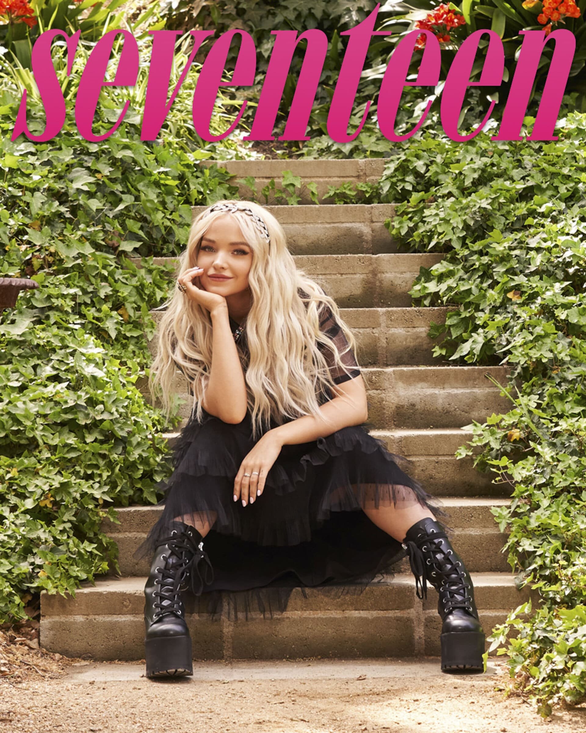 Teen magazine cover featuring Dove Cameron sitting on stone steps surrounded by green foliage wearing a black dress and platform boots.