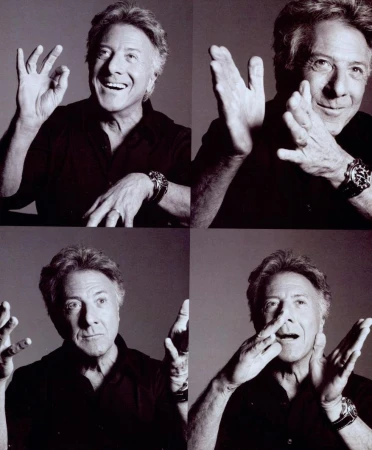 Black-and-white montage of Dustin Hoffman in four portraits, smiling and gesturing with his hands and wearing a dark shirt and watch.