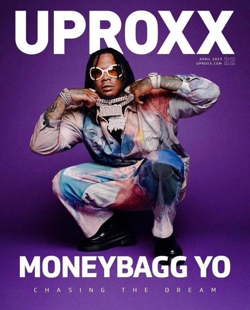 Magazine cover featuring Moneybagg Yo, wearing sunglasses and jewelry, against a purple background with the UPROXX logo at the top.