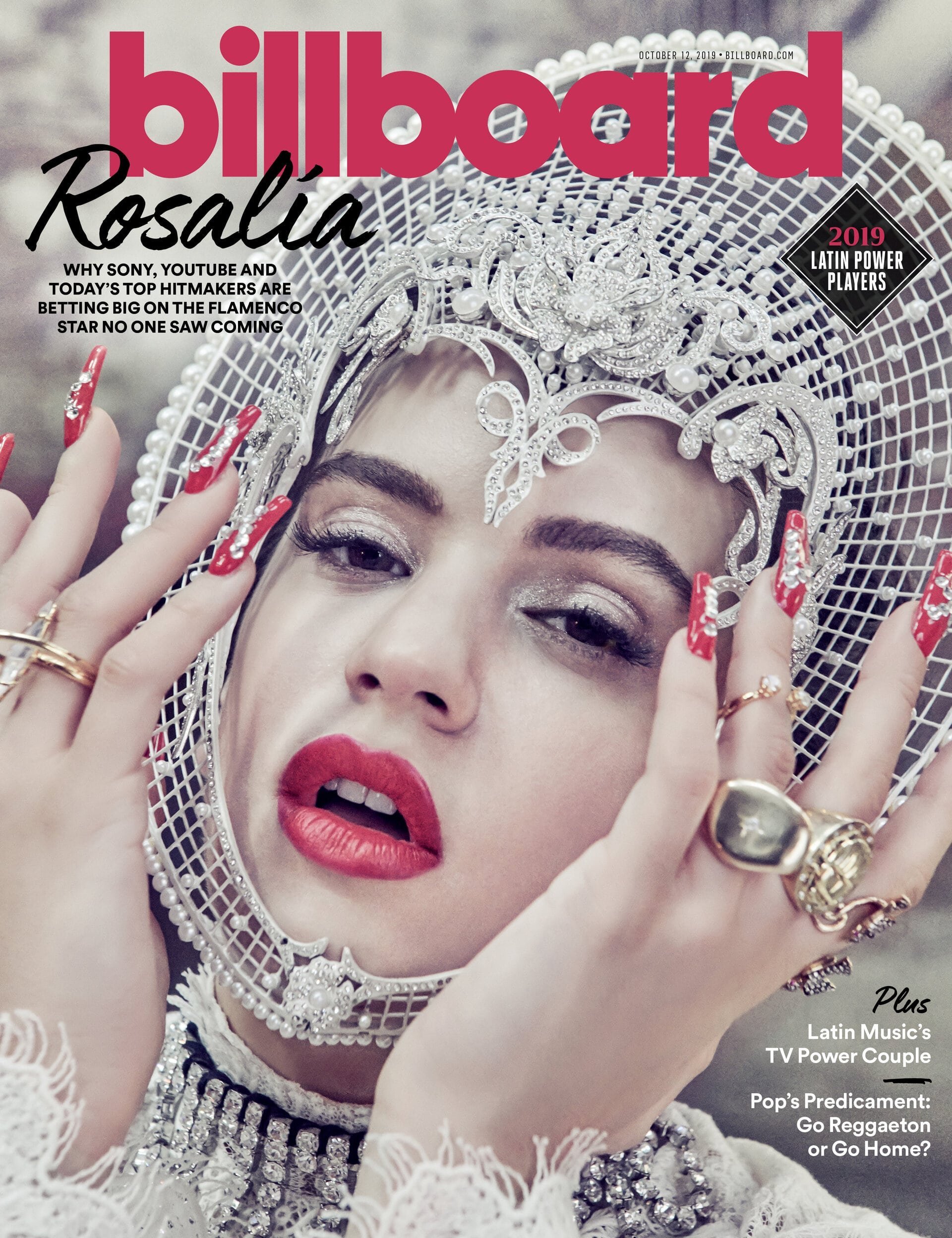 Rosalia on the cover of Billboard magazine. The image features a close-up of the singer wearing an ornate white headpiece and large gold rings.