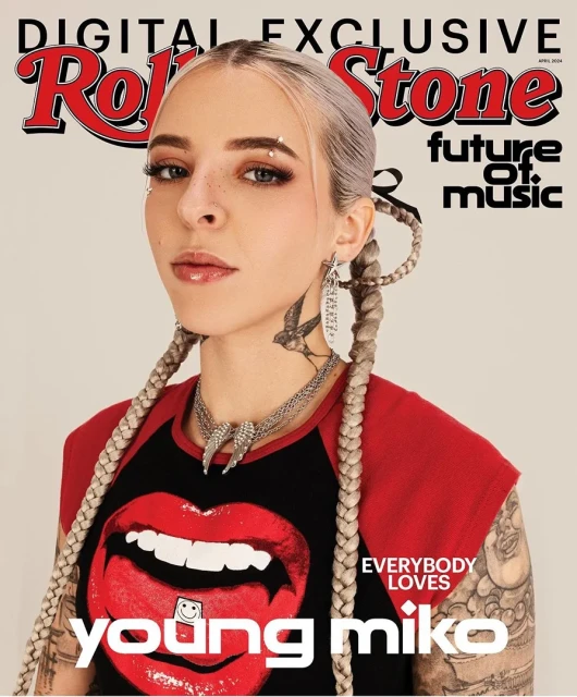 Rolling Stone magazine cover featuring singer Young Miko, showcasing silver hair braids, lip-graphic tee, and bold jewelry in portrait.