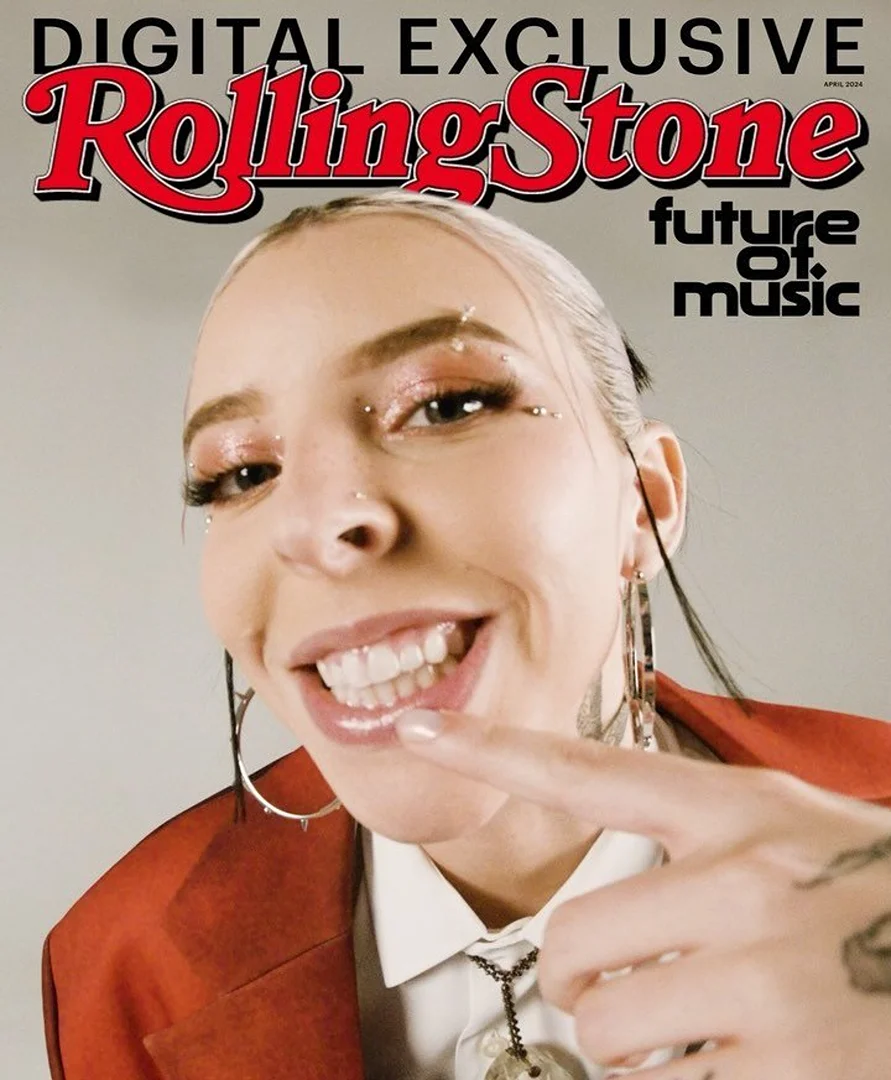 Rolling Stone magazine cover featuring a light-skinned woman with piercings and tattoos, wearing a red jacket and jewelry.