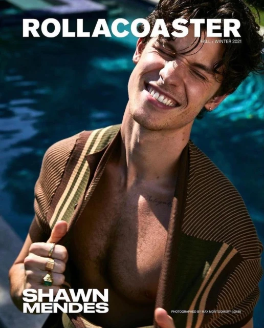 Shawn Mendes on the cover of RollaCoaster magazine, Fall/Winter 2021 issue. He's wearing a striped top with a pool in the background.