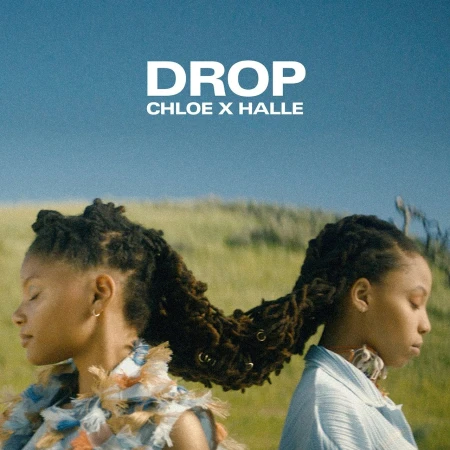 Music album cover for 'Drop' by Chloe x Halle featuring portrait of two young black female singers in an outdoor environment.