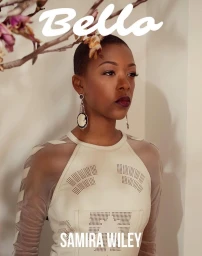Portrait of Samira Wiley wearing a cream leather dress with sheer mesh sleeves and large drop earrings in New York