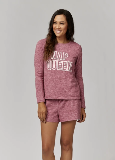 A woman in matching red lounge set poses on a white background. The long-sleeved top has the words 'NAP QUEEN' printed on it.
