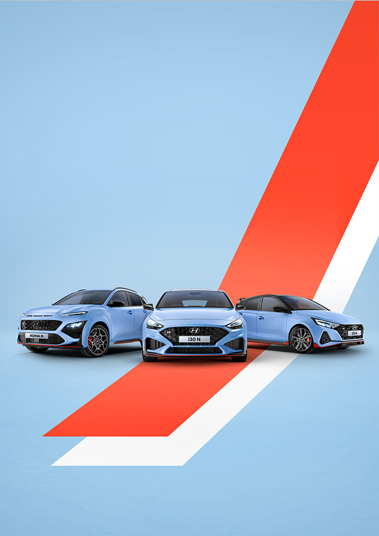 Three light blue Hyundai N series cars are featured against a gradient light blue and red background with a white stripe dividing the colors.