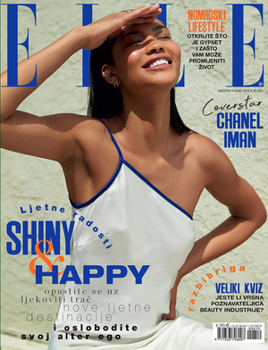 Chanel Iman on the cover of Elle magazine, posing in a bright studio environment with neutral colors and diffused lighting.