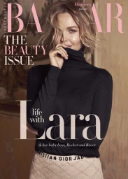 Magazine cover portrait of a blonde woman wearing a black turtleneck sweater and lace skirt by photographer Sylve Colless.