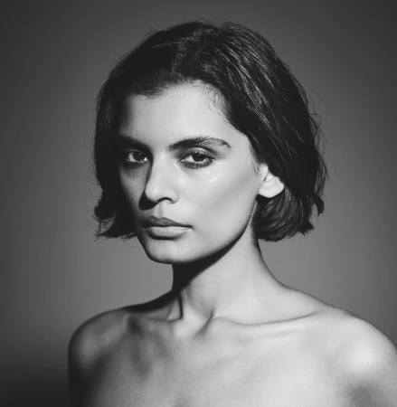 Portrait of a woman with dark short hair and intense gaze photographed by Sam McAdam-Cooper in Sydney.