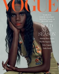 Magazine cover portrait of a Black woman with long dark wavy hair wearing an olive green floral dress, styled by Petta Chua.