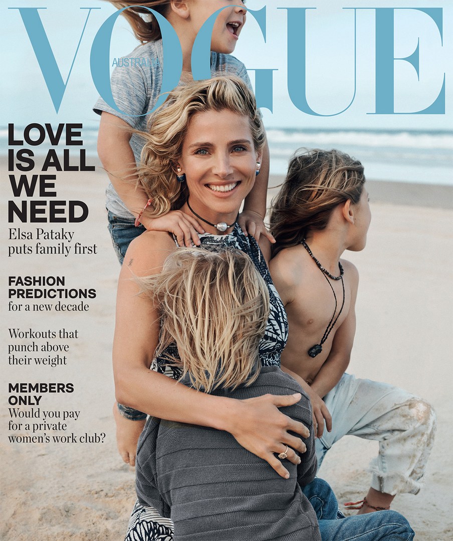 Vogue magazine cover featuring Elsa Pataky with three children on the beach. The magazine cover promotes family values and fashion trends.