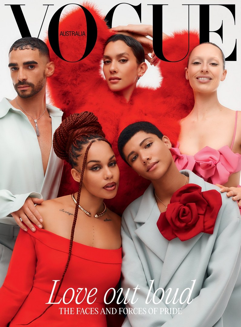 Vogue Australia cover featuring five models in red and pastel outfits. The models are posing in front of a white background with a bold Vogue logo.