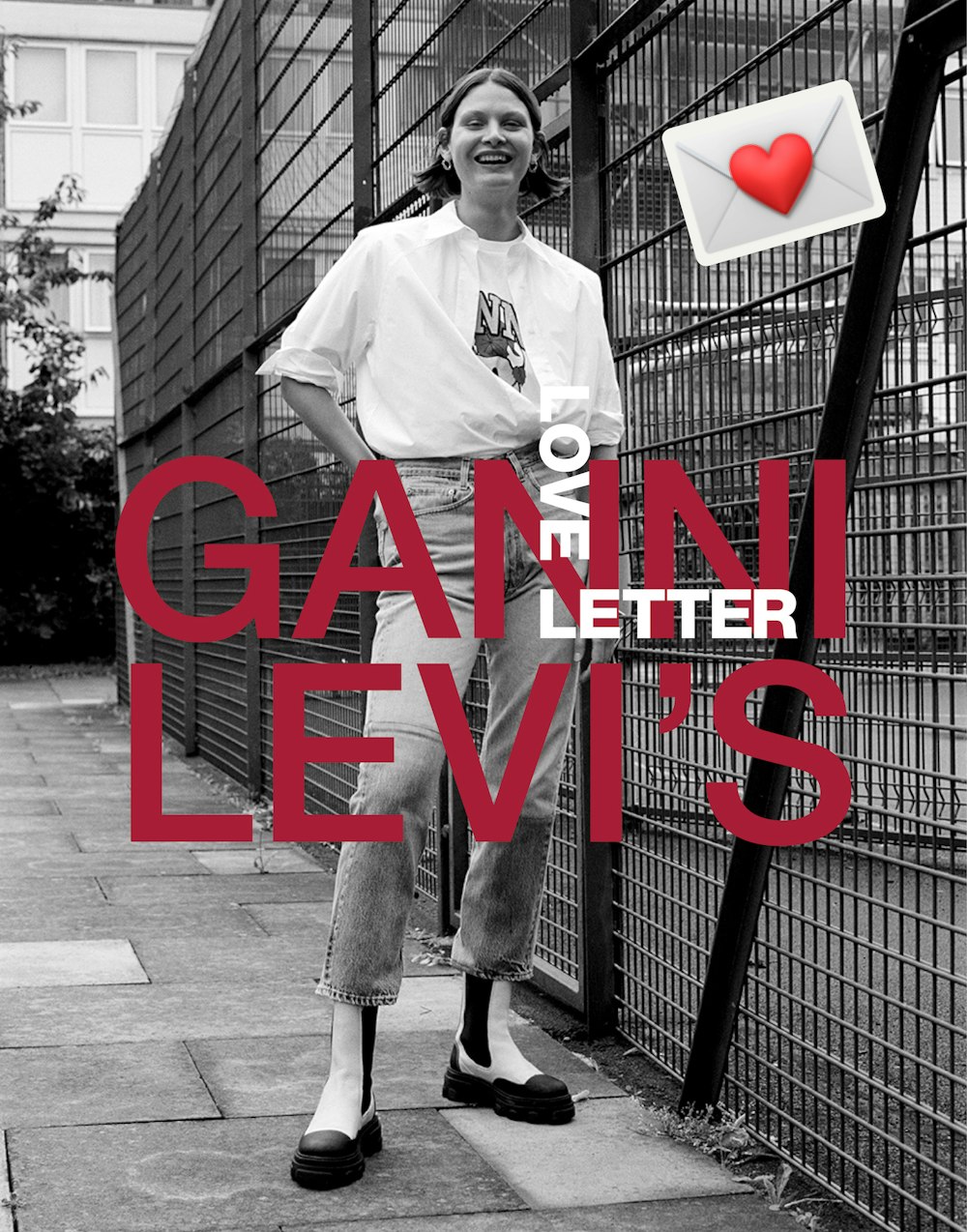 Adult woman poses in GANNI x Levi's ad on urban street with black and white building and fence background with pink text overlay.