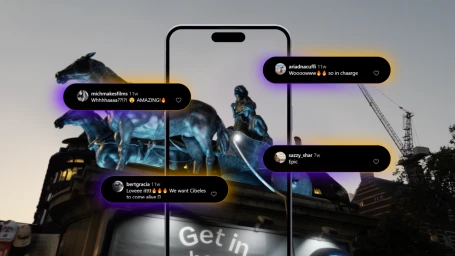 A smartphone frame overlays a bronze equestrian statue against a twilight sky, surrounded by glowing social media comment bubbles.