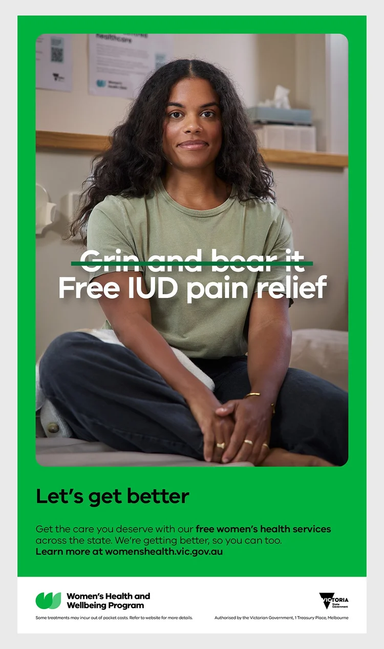 Woman seated wearing an olive green t-shirt and dark trousers in an interior healthcare setting with text overlay