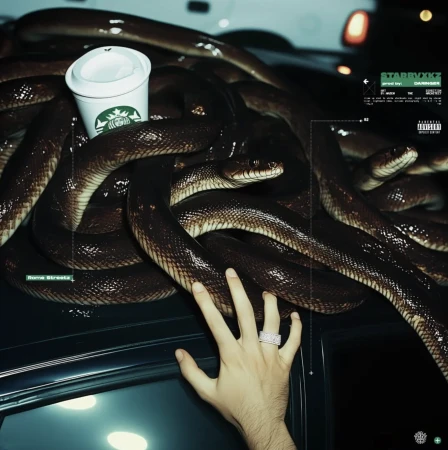 Snakes are coiled around a Starbucks cup on a car with a hand visible. The background shows blurry cars at night.