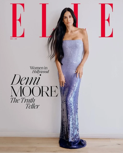 Demi Moore poses on the cover of Elle magazine wearing a strapless lavender sequin gown against a white backdrop and wood floor.