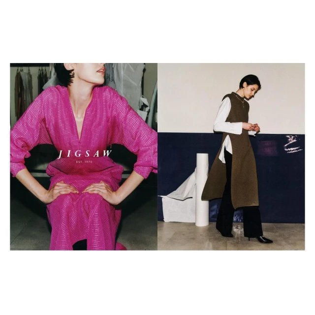 Two women model designs by Jigsaw. One wears a vibrant pink dress, the other an olive green tunic over a white shirt and black pants.