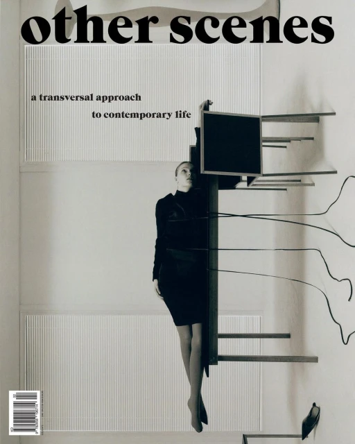 Black-and-white magazine cover shot indoors with a posed woman, stairs, a black television, and the magazine title "other scenes."