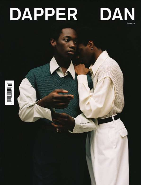 Magazine cover featuring two young adult men in vintage-inspired fashion, captured against a dark background with a modern, editorial style.