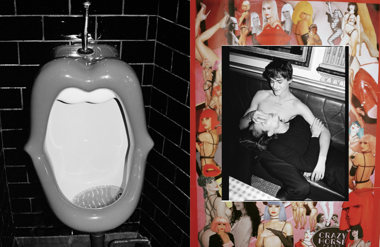 Mouth-shaped urinal in a bathroom with black brick walls, juxtaposed with a black and white photo of a couple and collage art.
